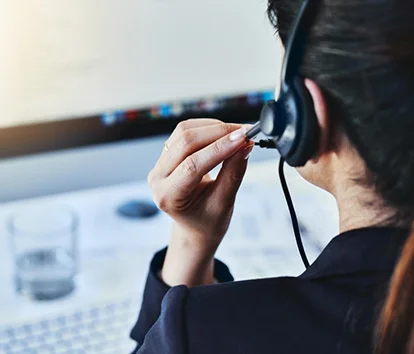 a person adjusting microphone of headphones